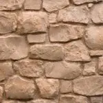 ROCKS Mokka wandbekleding met warme aardetinten en robuuste, natuursteen look.